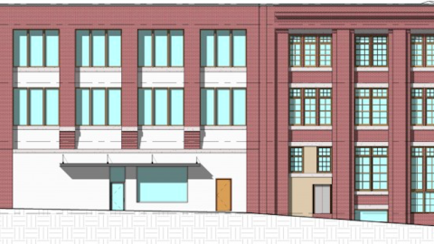 A historic looking old building of red brick. 
