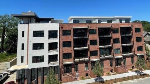 A new condo building in white a brick in Atlanta. 