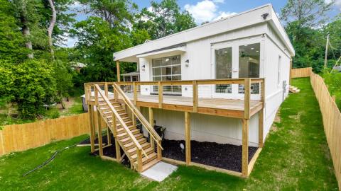 A white home built of shipping containers in a modern style in Atlanta. 
