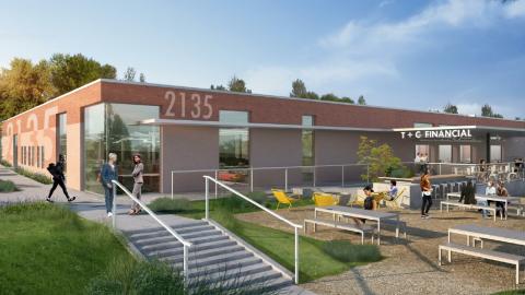 A rendering of a large warehouse made into offices with outdoor seating. 