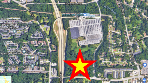 An aerial image of a huge townhome project property in Atlanta among trees. 