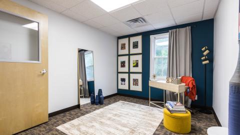 A photo of a brick office building converted into a series of mini office suites. 