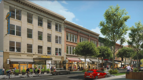 A rendering of a historic hotel building in downtown Atlanta under blue skies. 