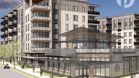 A rendering of a new apartment complex that's beige and brown along a road. 