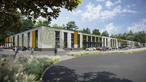 A rendering showing an old warehouse complex reborn as new office in a white building under blue skies. 