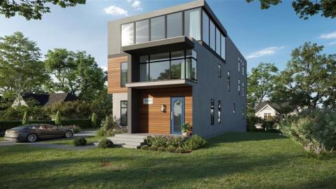 An image of a modern house among many other contemporary homes in Atlanta under blue skies. 