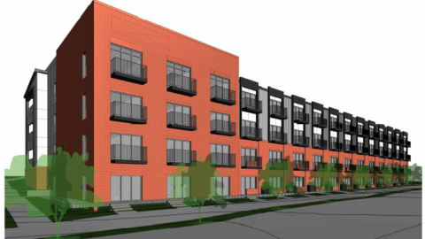 A rendering of a red brick building next to a large road with trees in front. 