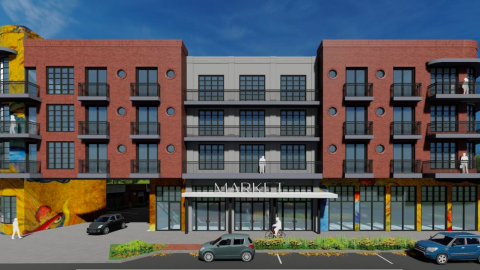 A rendering of a brick and gray development proposed in Atlanta under blue skies. 