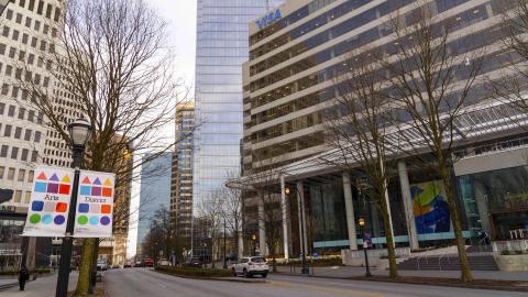 A photo of a large renovated office building in the middle of Atlanta with Visa employees and new furniture. 