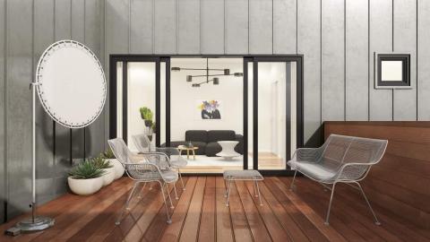 A private deck with gray walls off a condo building with nice modern furniture in Atlanta.