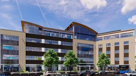 A rendering showing a glass and brick building under blue skies near large parking lots.
