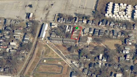 An image showing a former brown church under construction near a large pedestrian path in Atlanta.