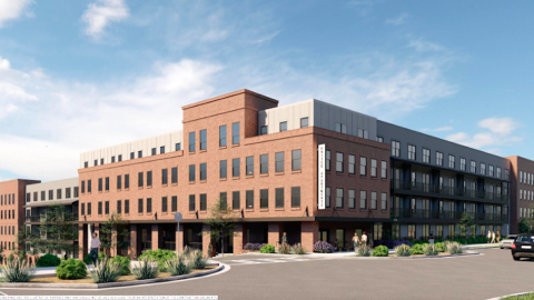 A rendering of a long four story building under blue skies in Atlanta. 