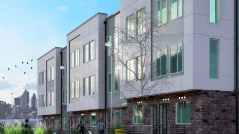 A rendering of a white and brick townhome a bike path running beside it near a wide street in Atlanta.
