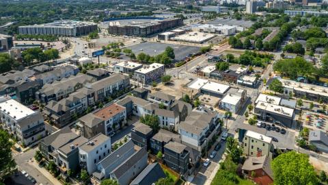 An image showing a range of houses and townhomes near a large park and wide streets just south of downtown Atlanta. 