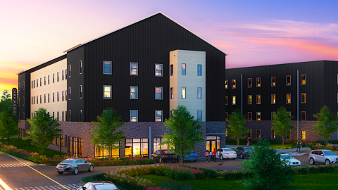 A rendering showing a large white and black building with affordable housing under purple and blue skies in Atlanta near a wide highway. 