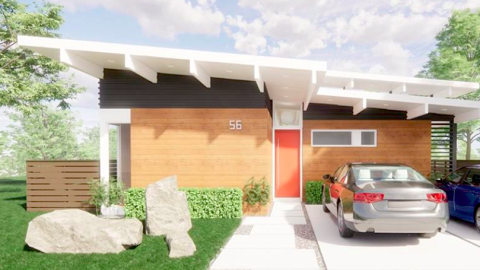 An image of a midcentury-modern style home under blue skies in Atlanta with tall ceilings and rocks in the yard.