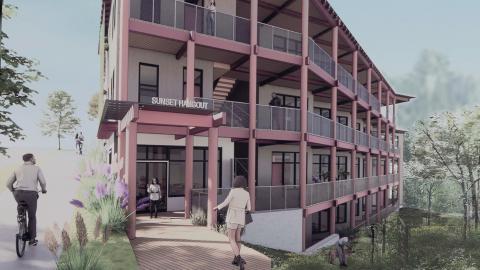 An image showing a site where stacked affordable housing is planned, under blue skies.
