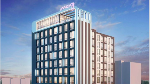 A rendering showing a large hotel with a curved top under blue purple skies in Atlanta with a purple sign.