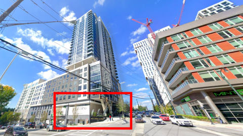 A photo of a posh new apartment tower in Atlanta under blue skies with a Mexican restaurant bound for a corner space near two wide streets.