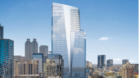 An image of a large glassy skycraper over the top of Atlanta's downtown skyline. 
